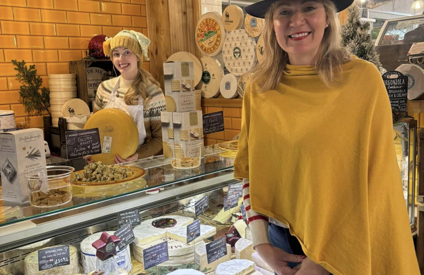 Laura in front of cheese display
