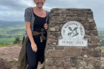 Laura in front of Skirrid Fawr Route Marker